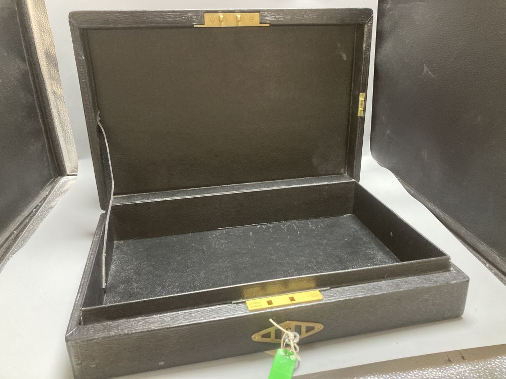 An antique parliamentary red leather despatch box and one other black box